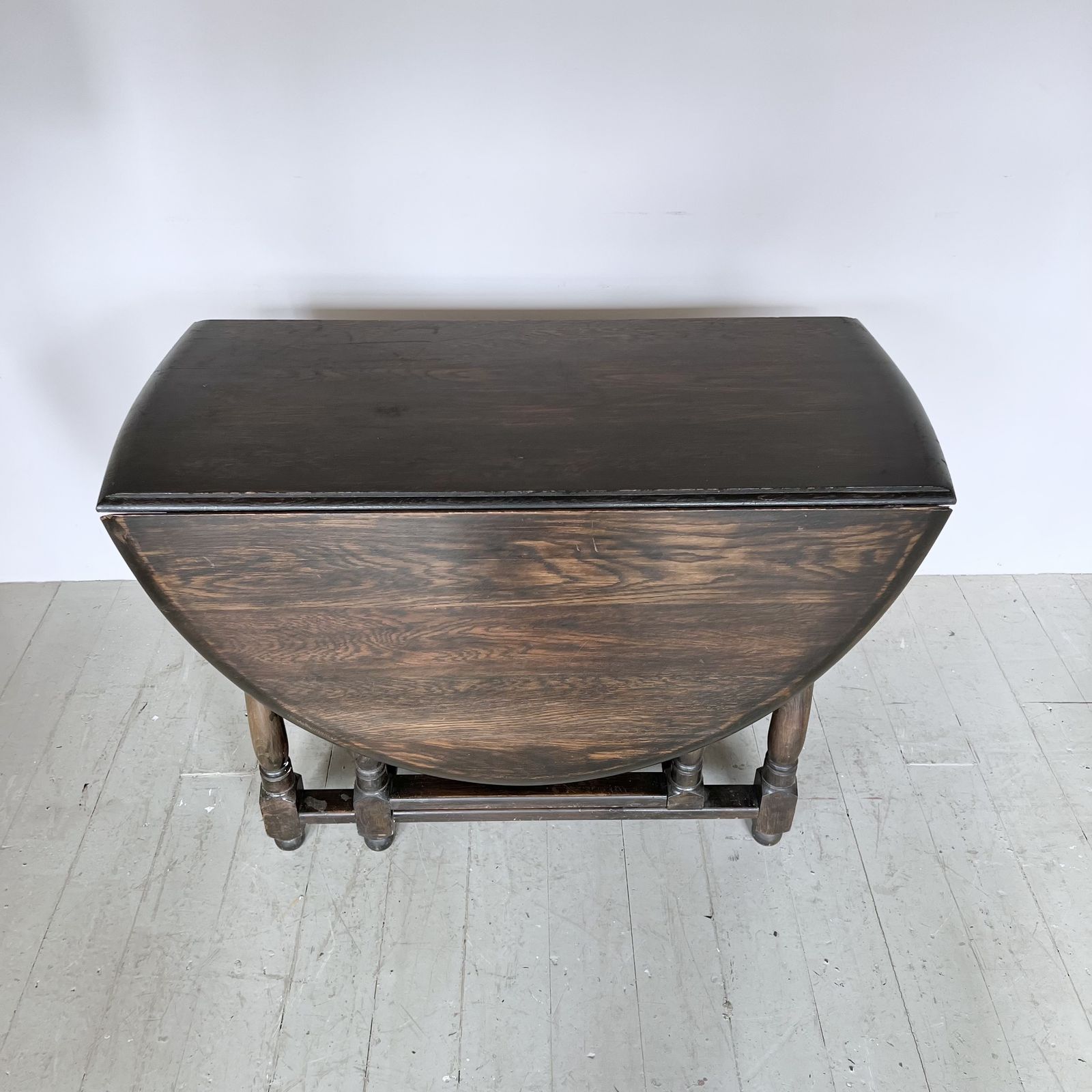 Dark Stained Solid Wood Oval Drop Leaf Table photo furniture