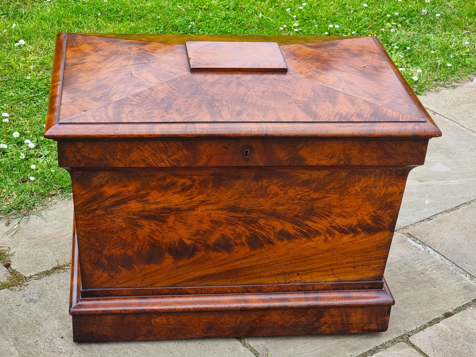 An English Regency Wine Cooler Sarcophagus Shaped And Superbly Veneered In Flame Mahogany, Circa 1820 photo for sale