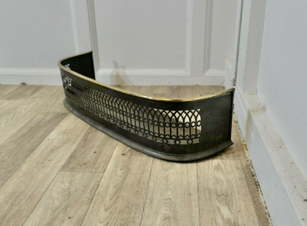 A Petite Victorian Pierced Brass And Iron Fender photo furniture