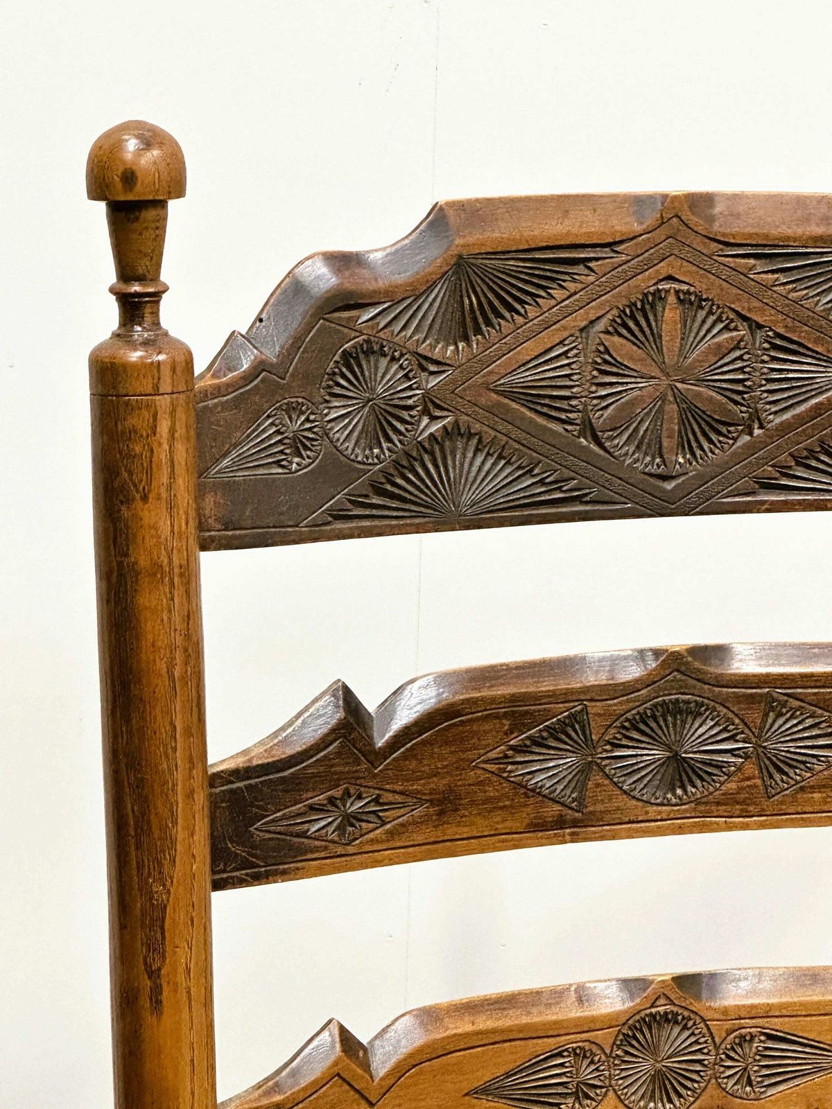 photo furniture 19th Century Handcrafted And Carved Ladder Back Chair, Circa 1840s.