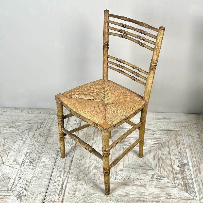photo furniture A Pair Of Painted Regency Faux Bamboo And Rush Seat Chairs