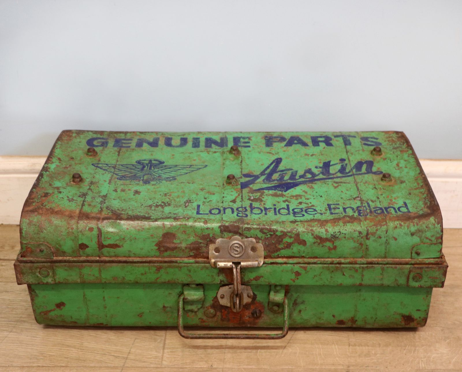 A Lovely Vintage Metal Trunk That Has Been Hand Sign Written With The Emblem For Austin Cars. photo furniture
