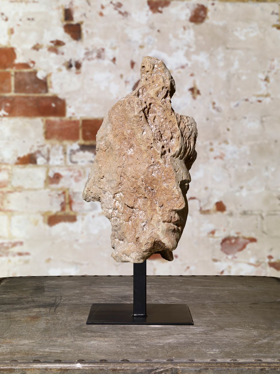 Carved Head Of A Lady In Stone. photo furniture
