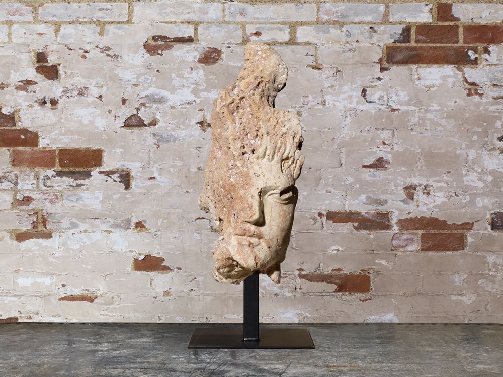 Carved Head Of A Lady In Stone.