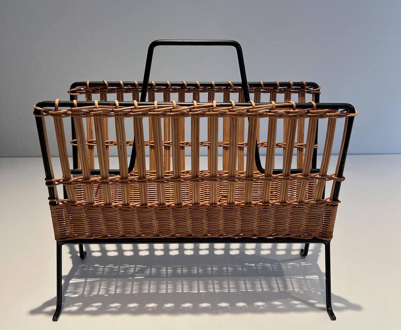 photo for sale Black Lacquered Metal And Rattan Magazine Rack