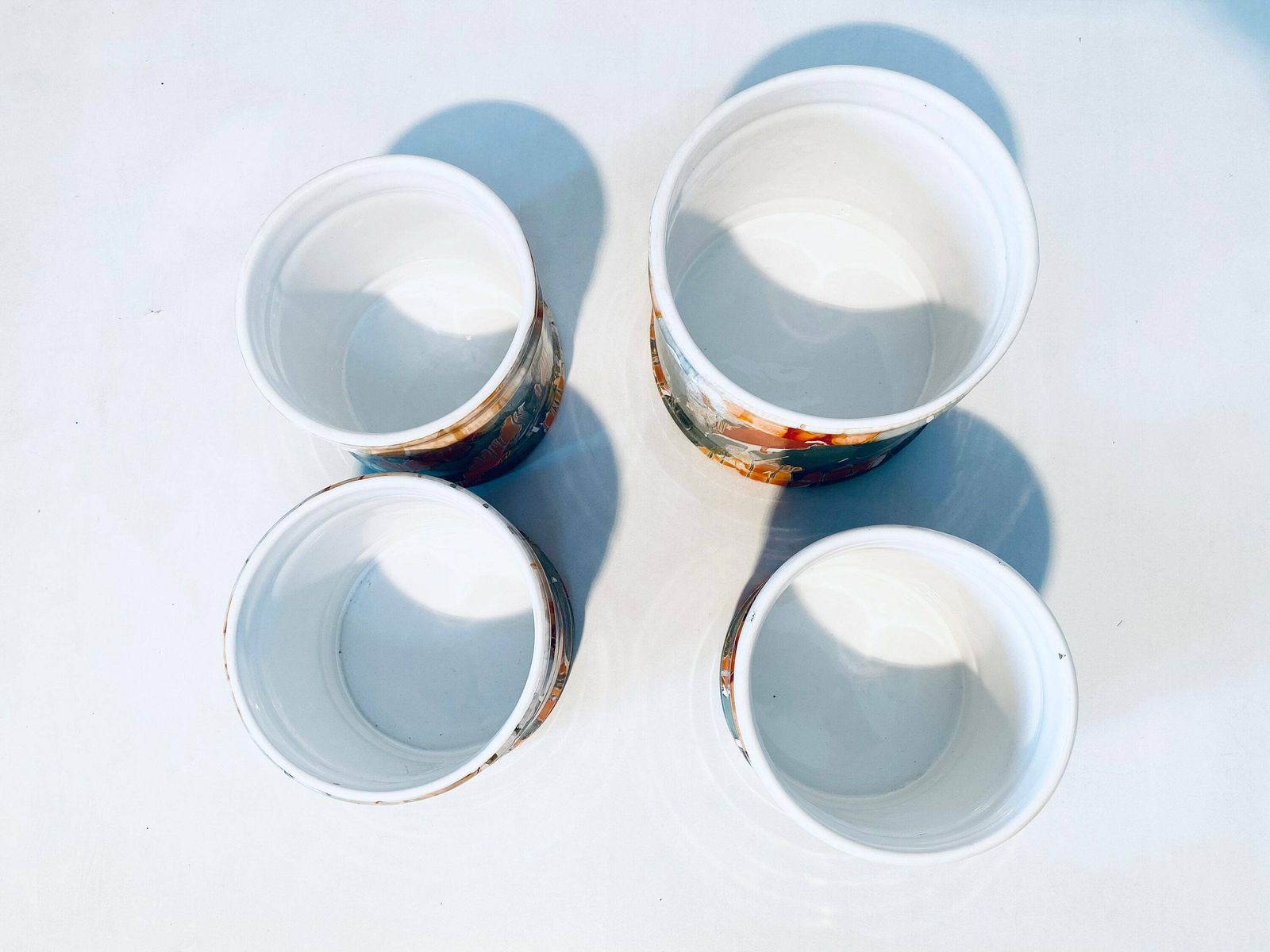 photo furniture Four Matching Ceramic Planters Set With Dripping Glaze Motif / Orange Petrol White