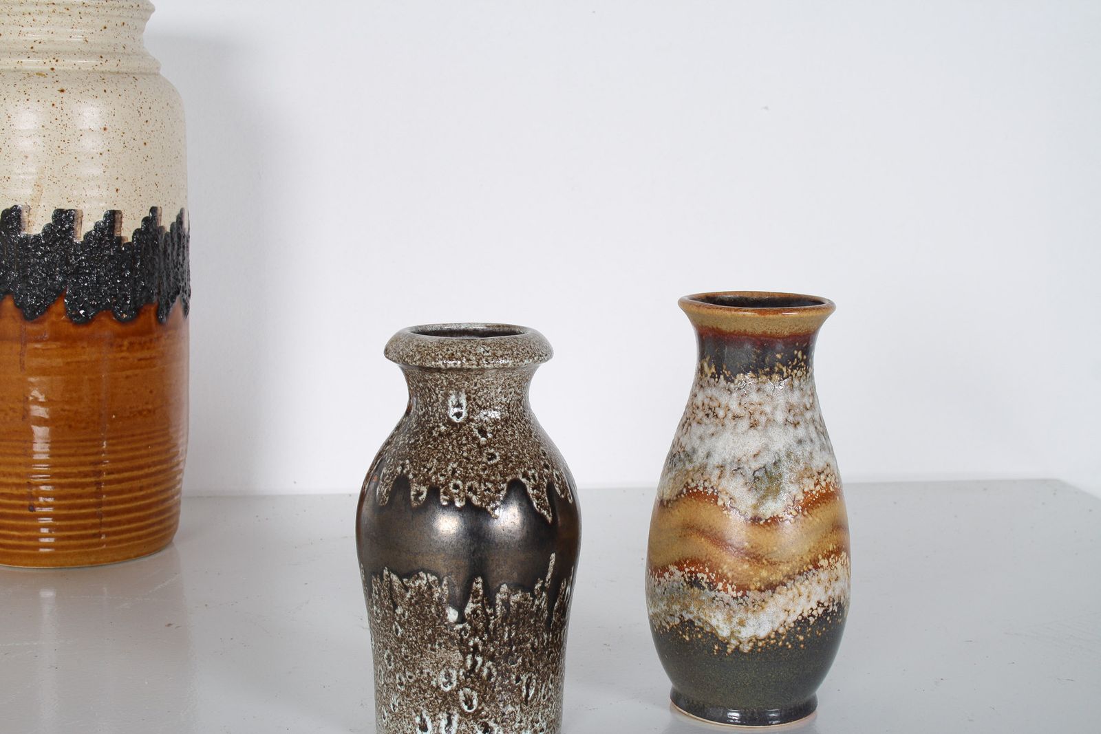 A Pair Of West German Pottery Lava Vases In Earthy Vibrant Tones photo for sale