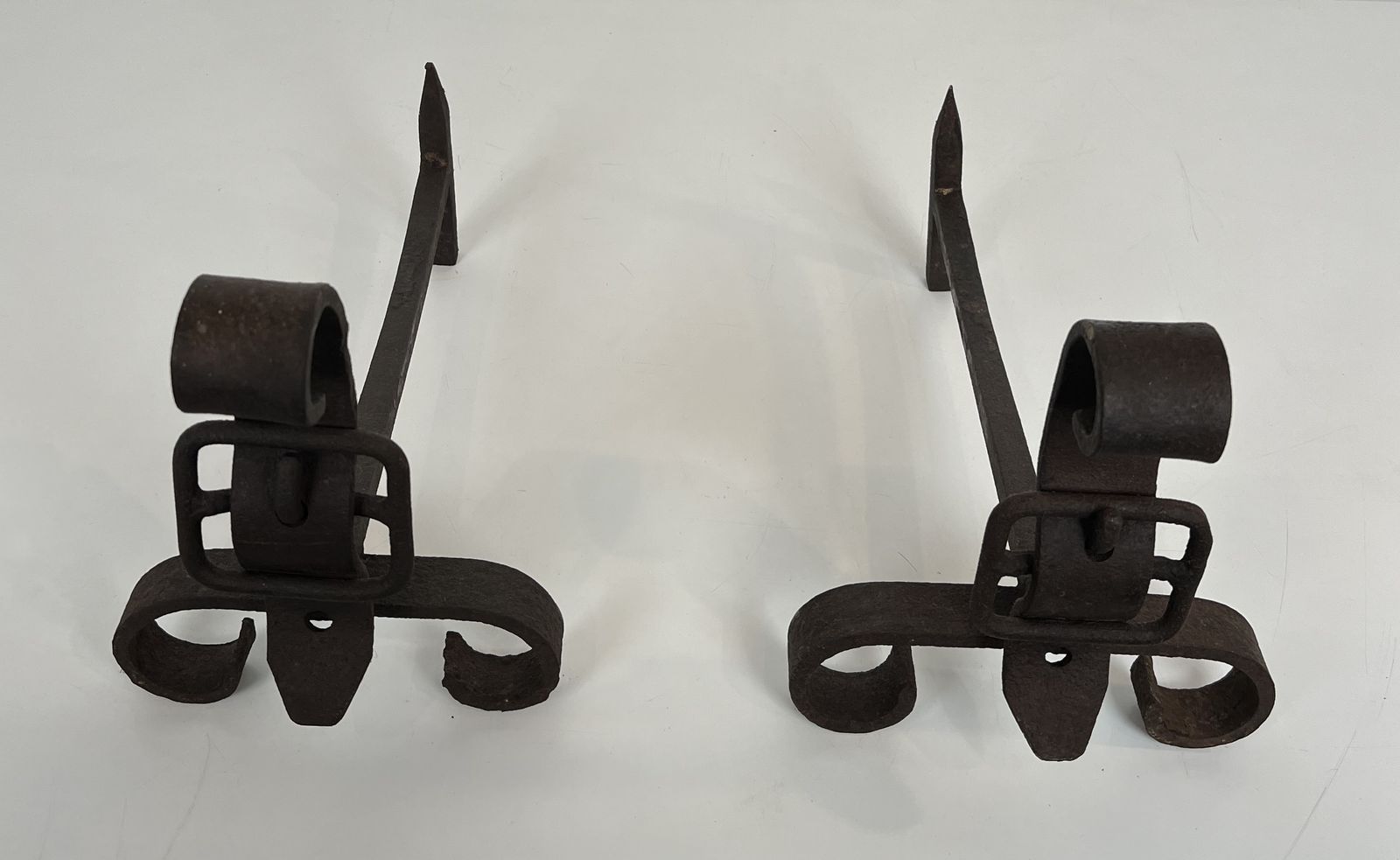 Pair Of Modernist Andirons Representing A Belt photo Home Fixtures