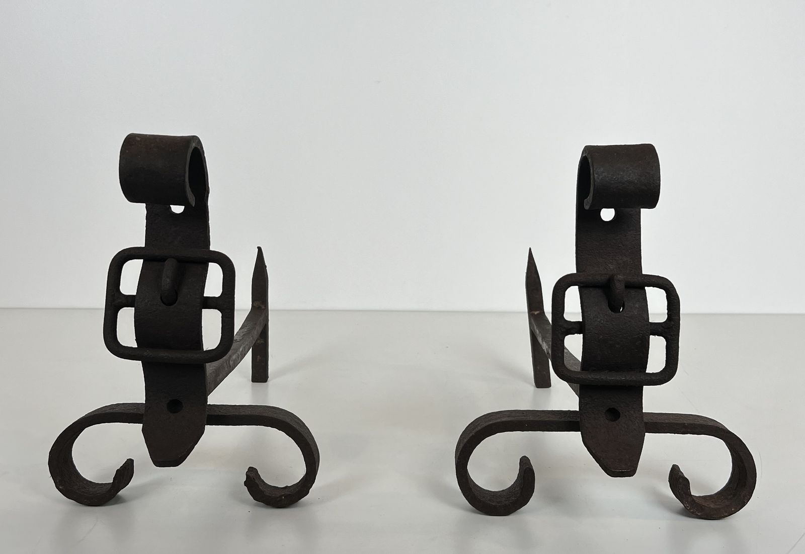 photo furniture Pair Of Modernist Andirons Representing A Belt