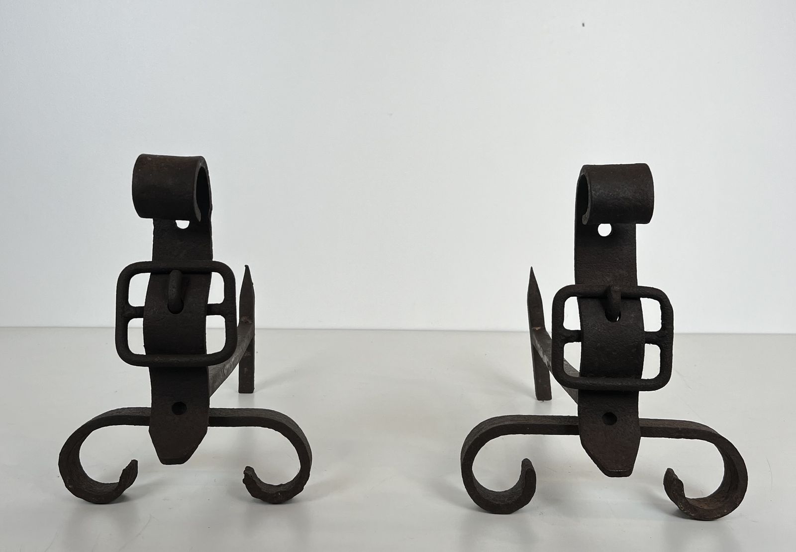 photo for sale Pair Of Modernist Andirons Representing A Belt