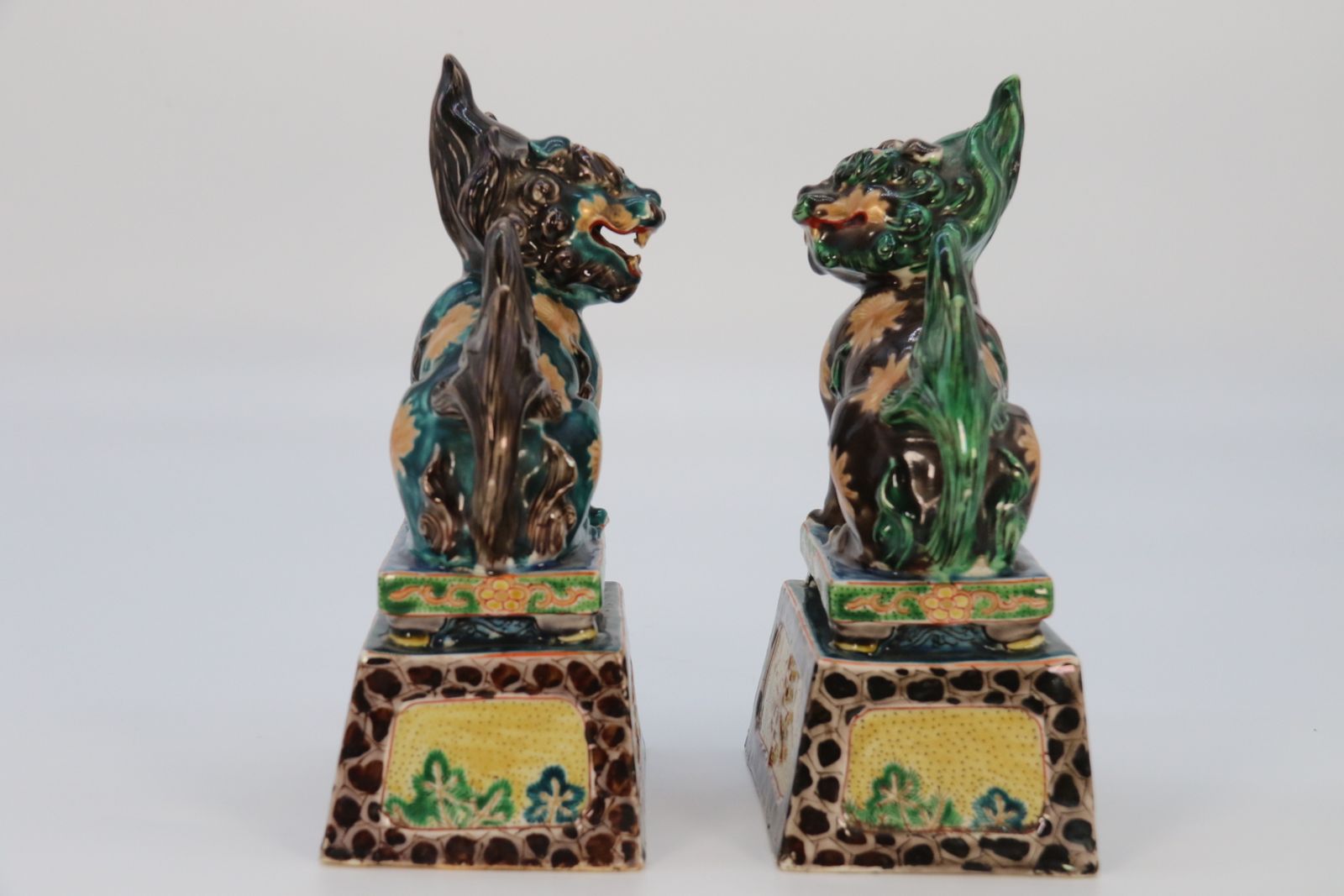 photo for sale A Highly Decorative Pair Of Chinese Pottery Buddhist Lions Circa 1900.