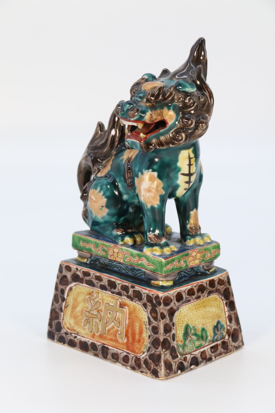 photo buy A Highly Decorative Pair Of Chinese Pottery Buddhist Lions Circa 1900.