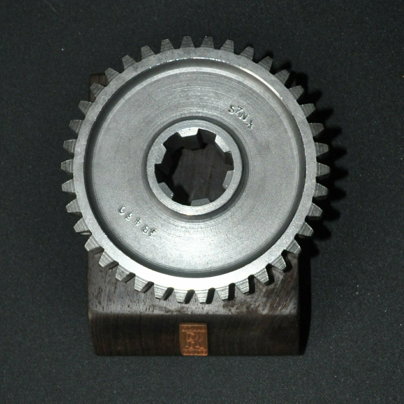 Rolls Royce Car Engine Gear On Hard Wood Base photo for sale