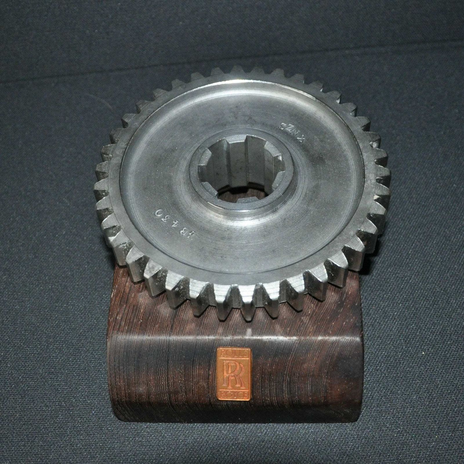 Rolls Royce Car Engine Gear On Hard Wood Base photo 135.0