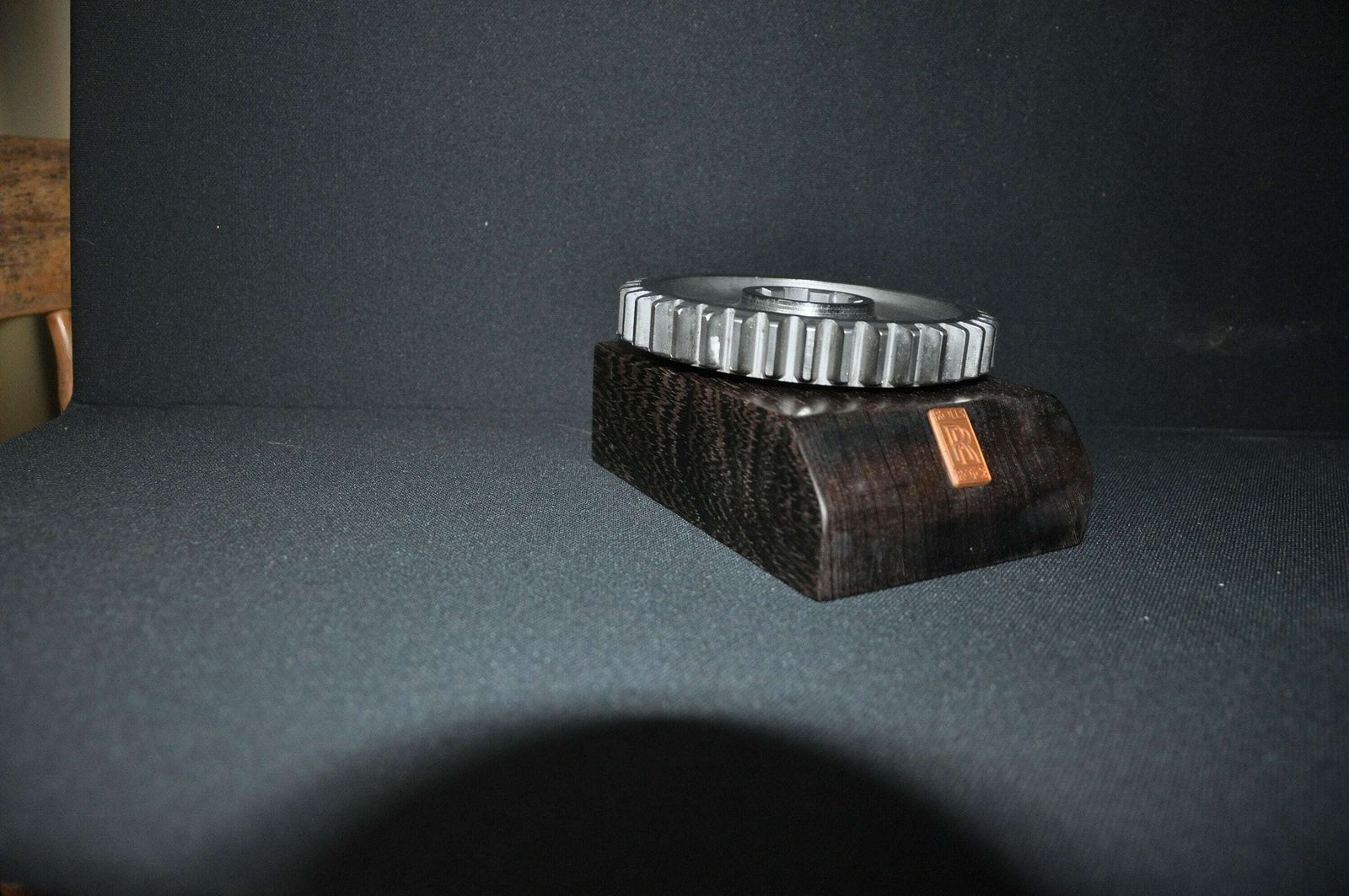 Rolls Royce Car Engine Gear On Hard Wood Base photo vinterior