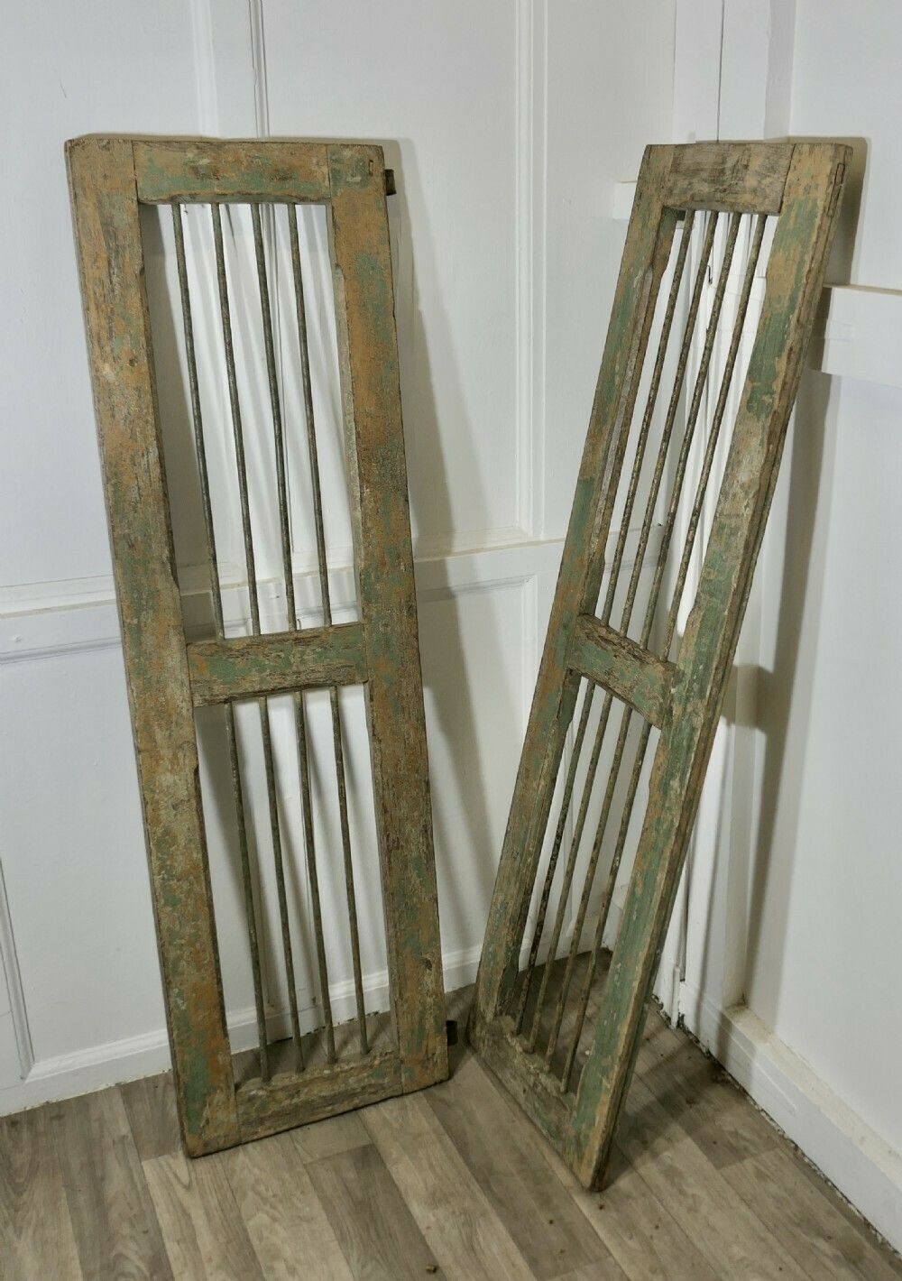 A Pair Of Antique Wood And Iron Window Shutters photo for sale
