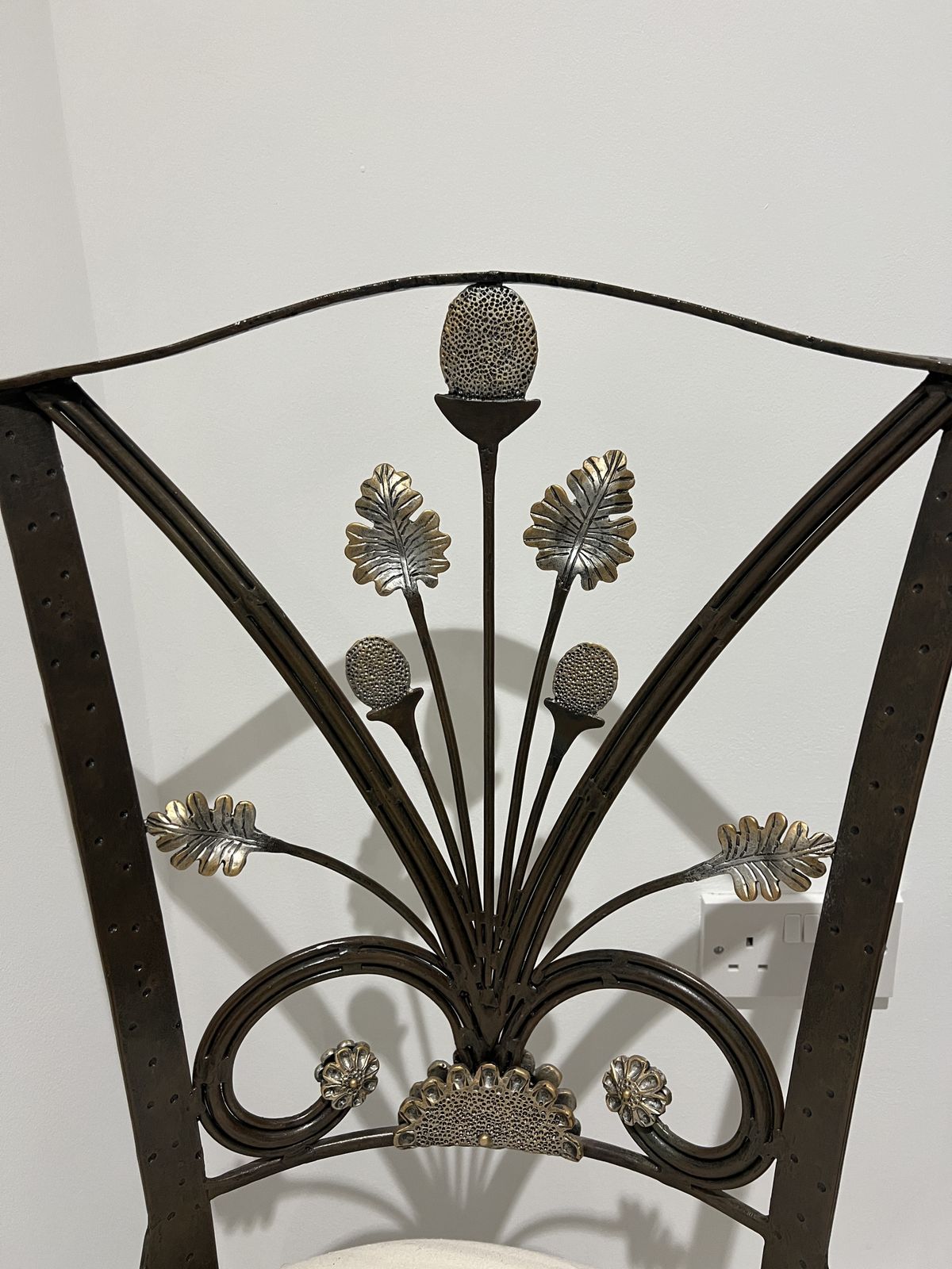 Elegant Black Wrought Iron Chair With Floral Backrest Design photo for sale
