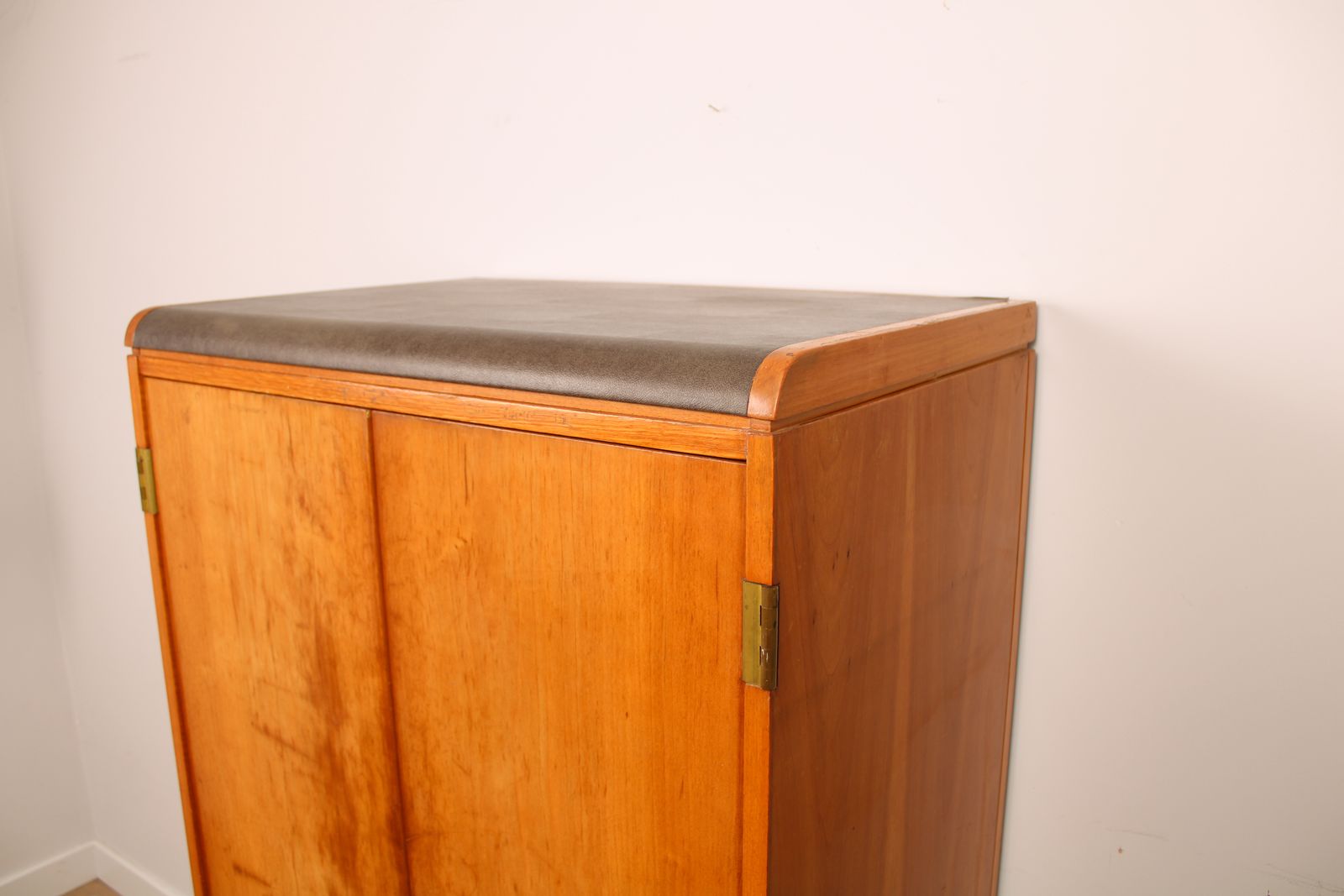 photo vinterior A Vintage Mid Century Cupboard, With Faux Leather Top And Recessed Metal Handles