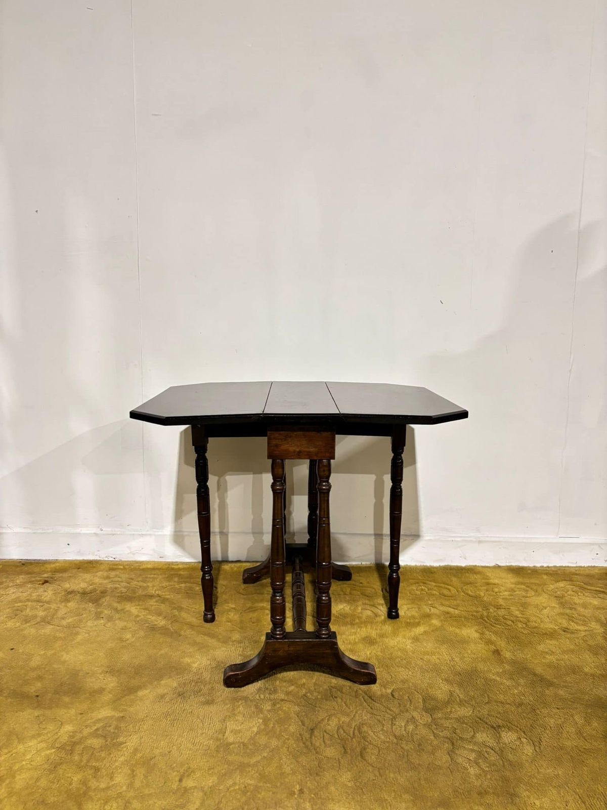 135.0 Edwardian Mahogany Table Of Small Proportions Resting On Turned Legs.(Regent St, Goodyers London.W.) photo