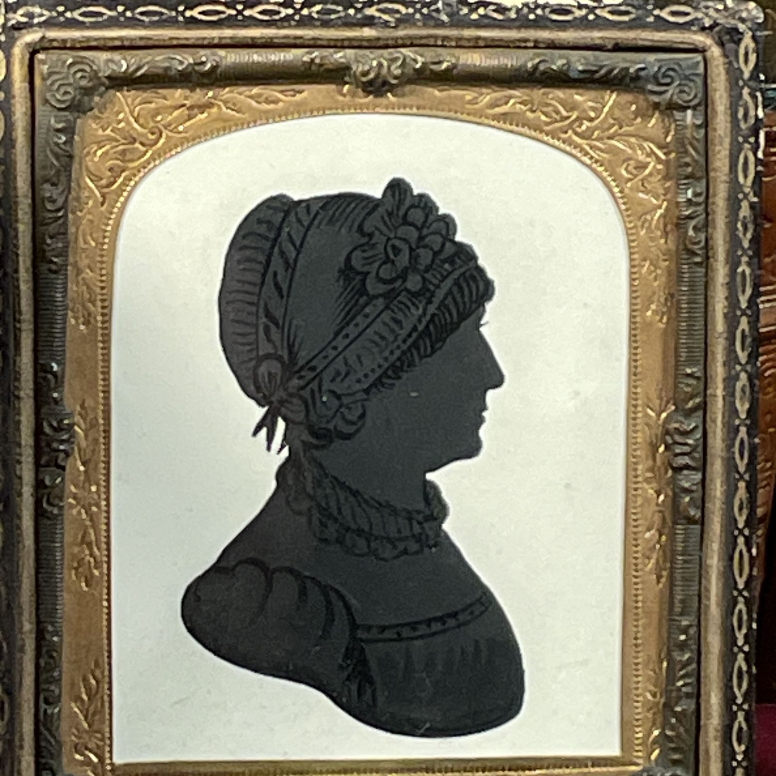 A Small Silhouette Of A Lady In A Bonnet photo furniture