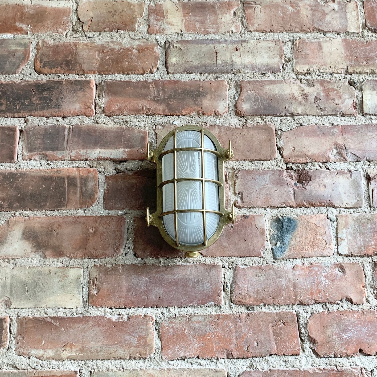 Contemporary Polished Brass Oval Bulk Head Wall Light photo for sale