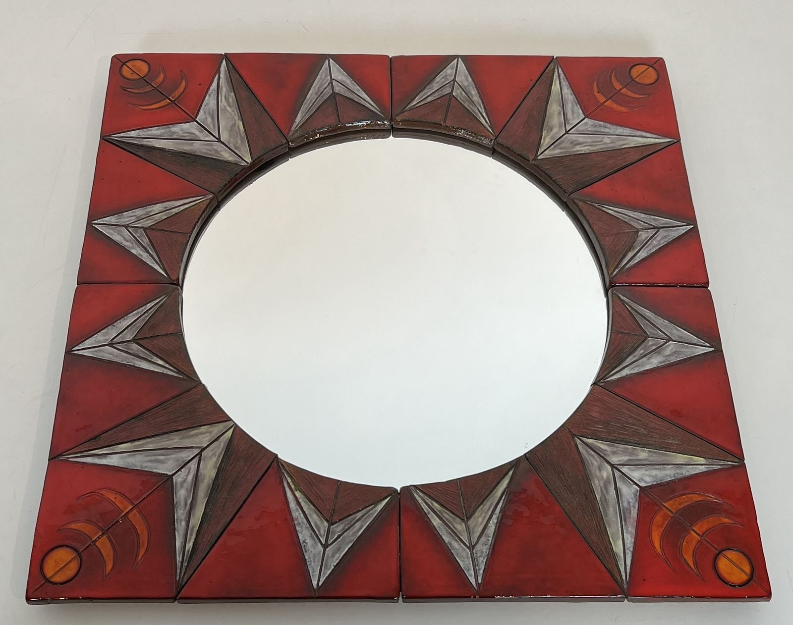 Ceramic Mirror Depicting A Stylized Sun On A Red Background Attributed To Oswald Tiberghien