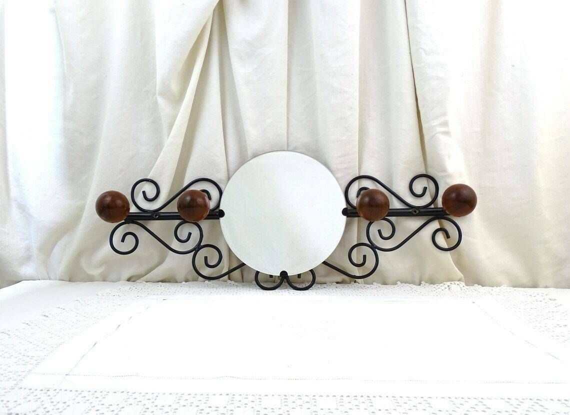 photo furniture Vintage French Wall Mounted 4 Ball Hook Coat Rack With Round Mirror And Black Forged Metal Frame, Retro 1960s Hall Furniture From France
