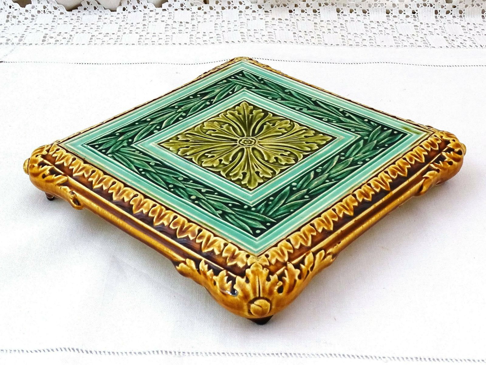 Rare Large Antique French Square Majolica Pottery Table Trivet In Green Tones And Golden Brown With Arts And Crafts Style Tile Pattern