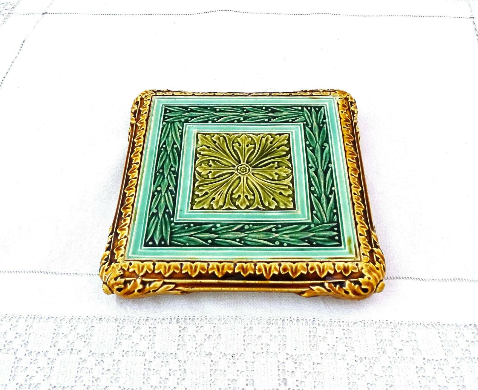 Rare Large Antique French Square Majolica Pottery Table Trivet In Green Tones And Golden Brown With Arts And Crafts Style Tile Pattern photo for sale