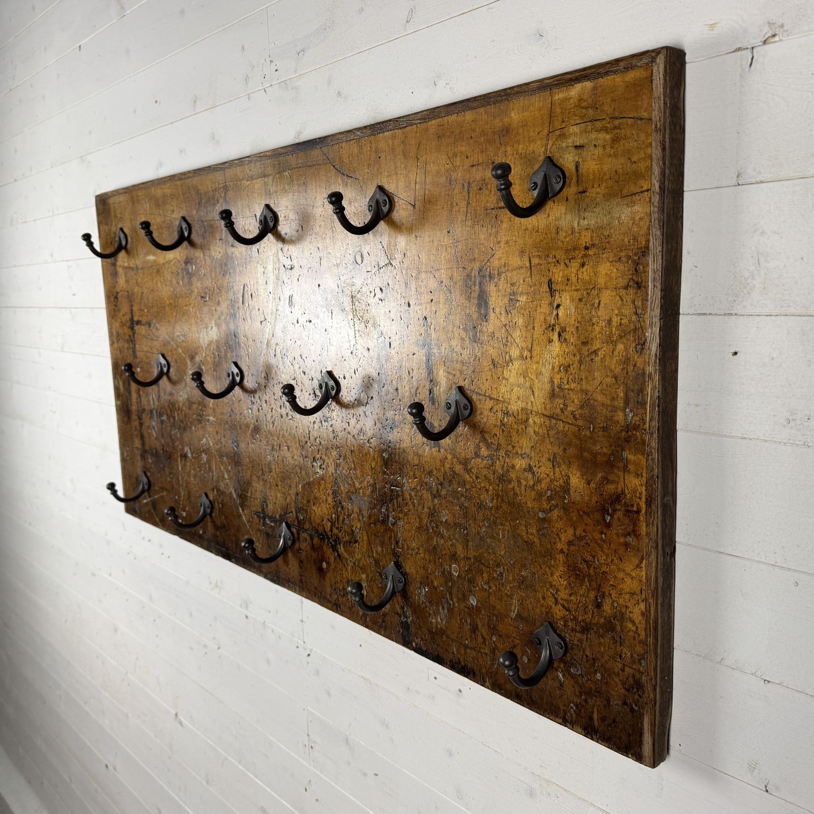 Set Of 14 Iron Hooks On Reclaimed Industrial Hardwood Board photo for sale
