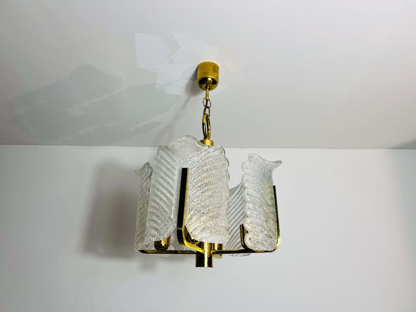 photo furniture Large Rare Midcentury 4 Arm Brass And Ice Glass Chandelier, 1960s