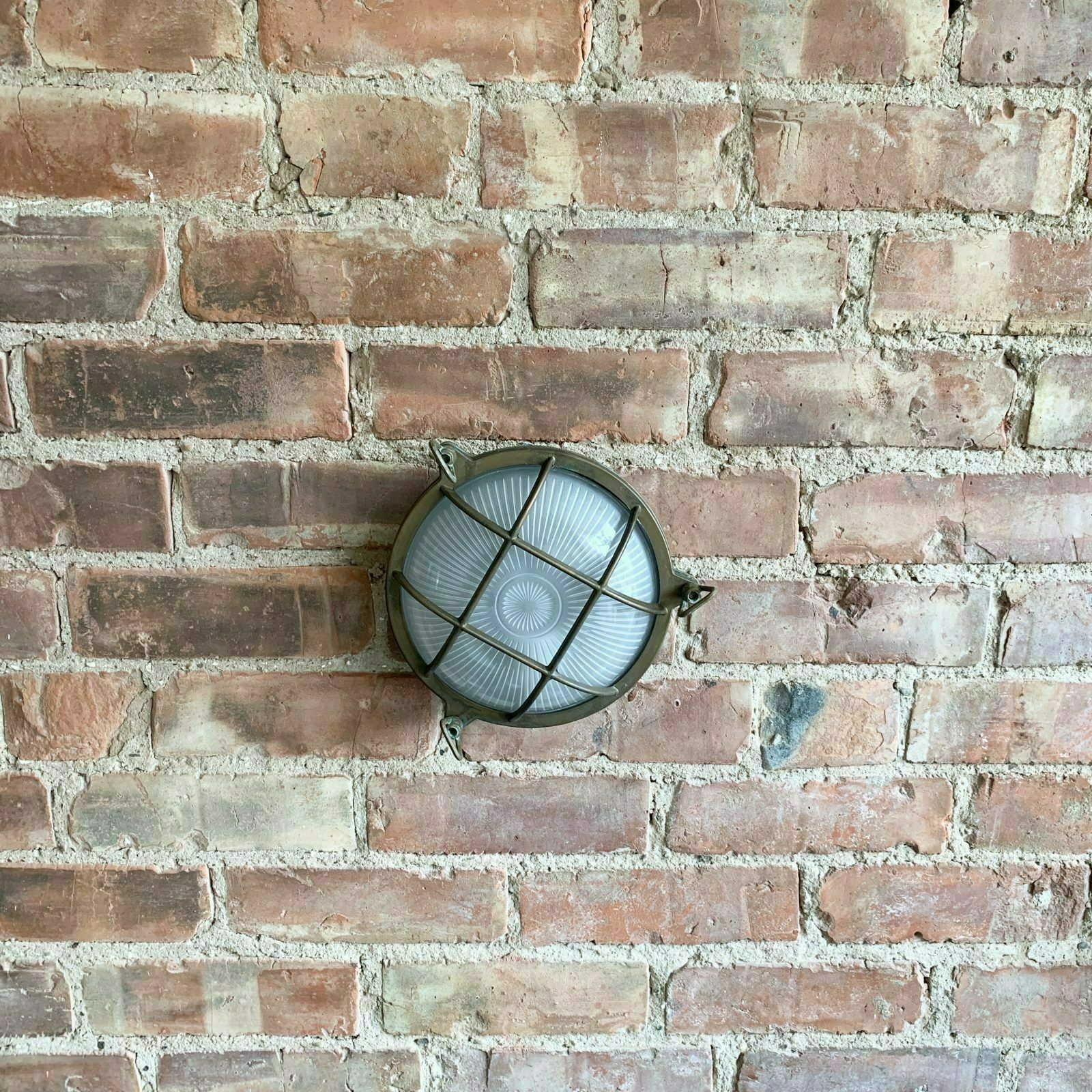 Contemporary Large Aged Brass Round Bulk Head Wall Light photo for sale