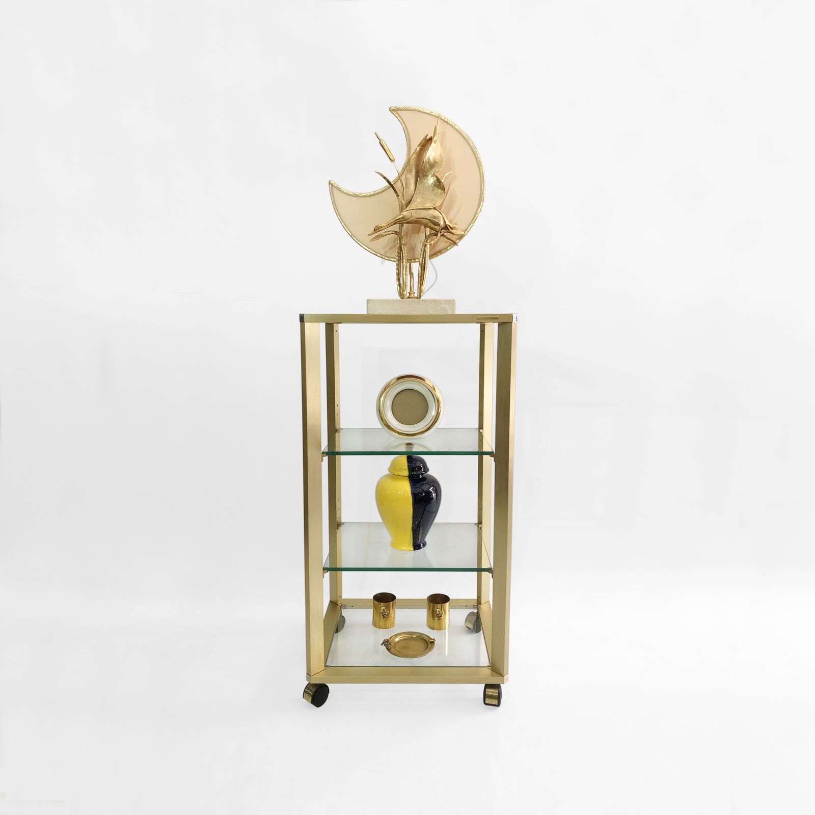 photo for sale Pierre Vandel Gold Glass Etagere On Wheels 1970s Mid Century Hollywood Regency Shelving Trolley Drinks Cart