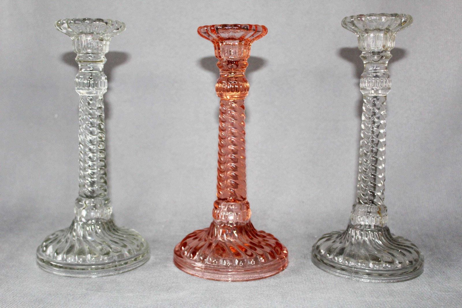 Three Art Deco Pressed Glass Candlestick Holder, Clear And Pink Rosaline Candle Holder, Scailmont Or Durover Belgium, Twisted Design photo for sale