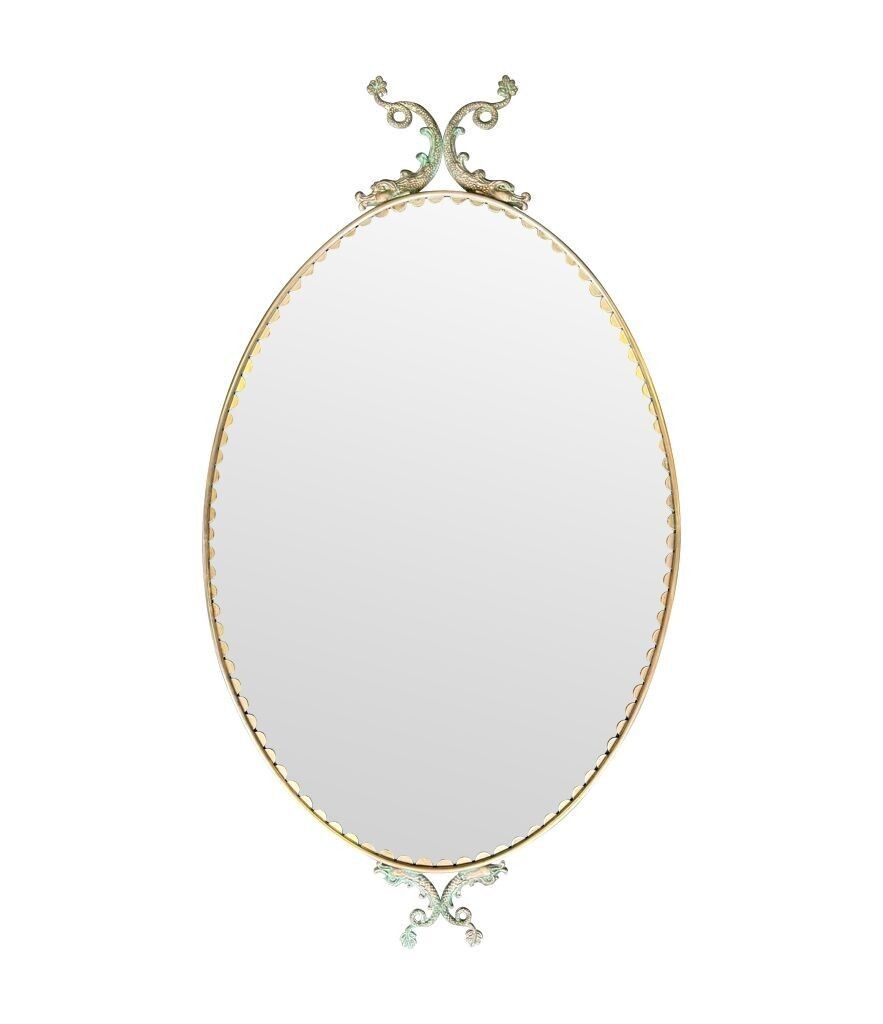 A Pair Of Italian 1940s Oval Mirrors With Dolphin Detailing Around The Brass Frame photo for sale