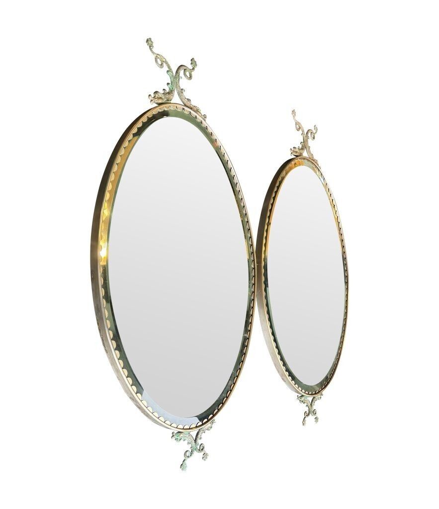 A Pair Of Italian 1940s Oval Mirrors With Dolphin Detailing Around The Brass Frame photo Home Decor