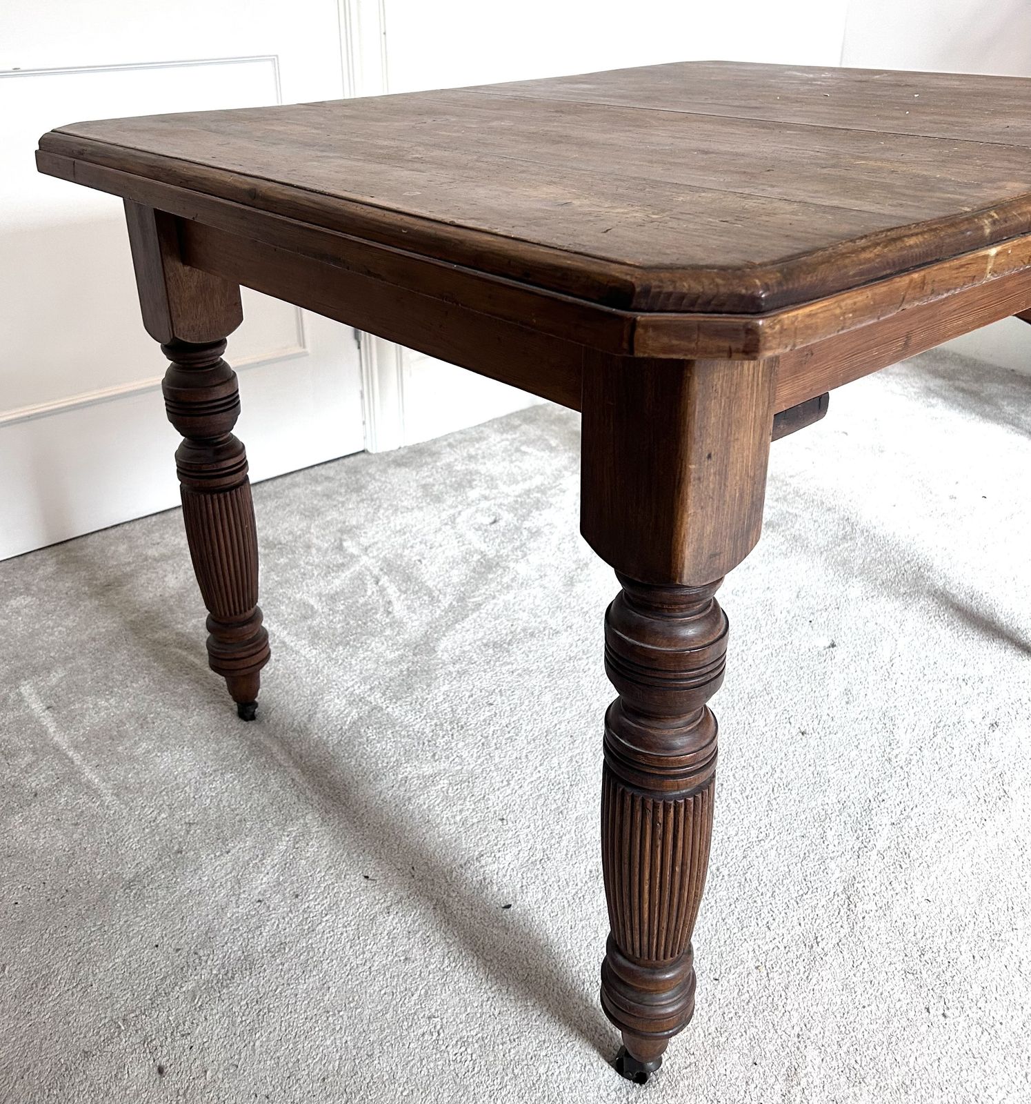 Victorian Farmhouse Table. Dark Stained Carved Wood. Original Castor Wheels photo for sale