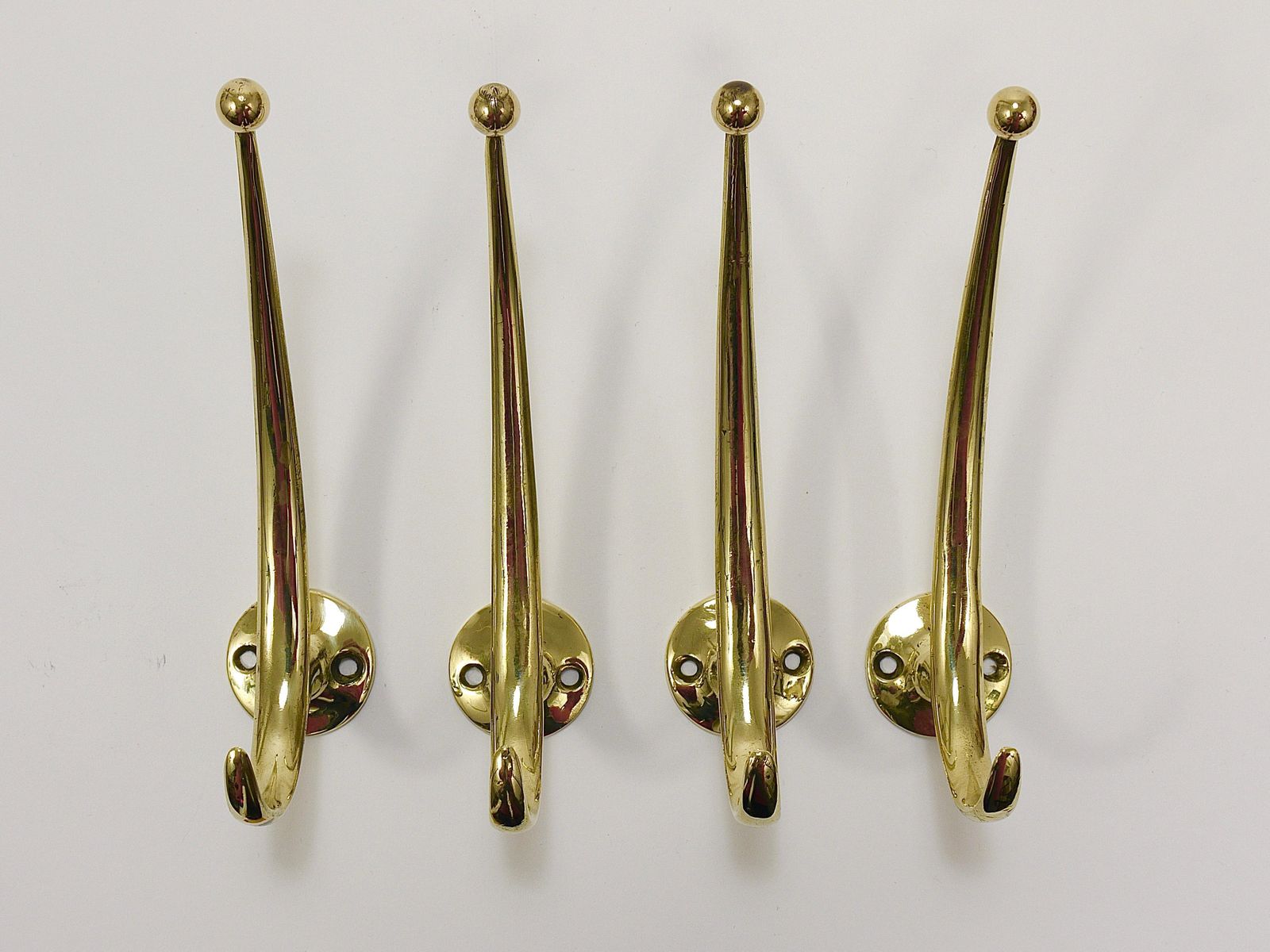 photo furniture Two Franz Hagenauer Vienna Mid Century Curved Brass Wall Coat Hooks, 1950s