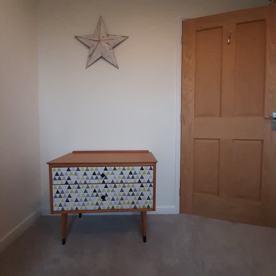 Mid Century Chest Of Drawers With Tapered Legs And Added Geometric Design. photo furniture