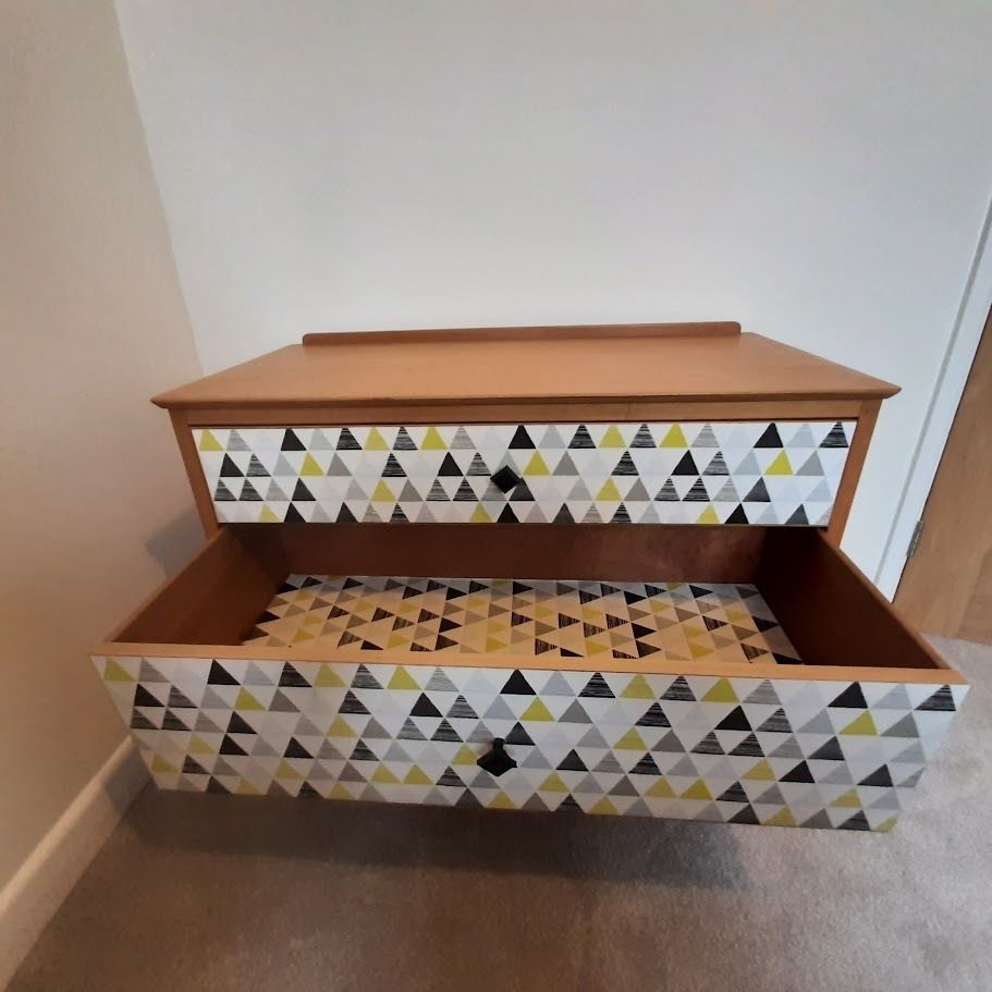 Mid Century Chest Of Drawers With Tapered Legs And Added Geometric Design. photo vinterior
