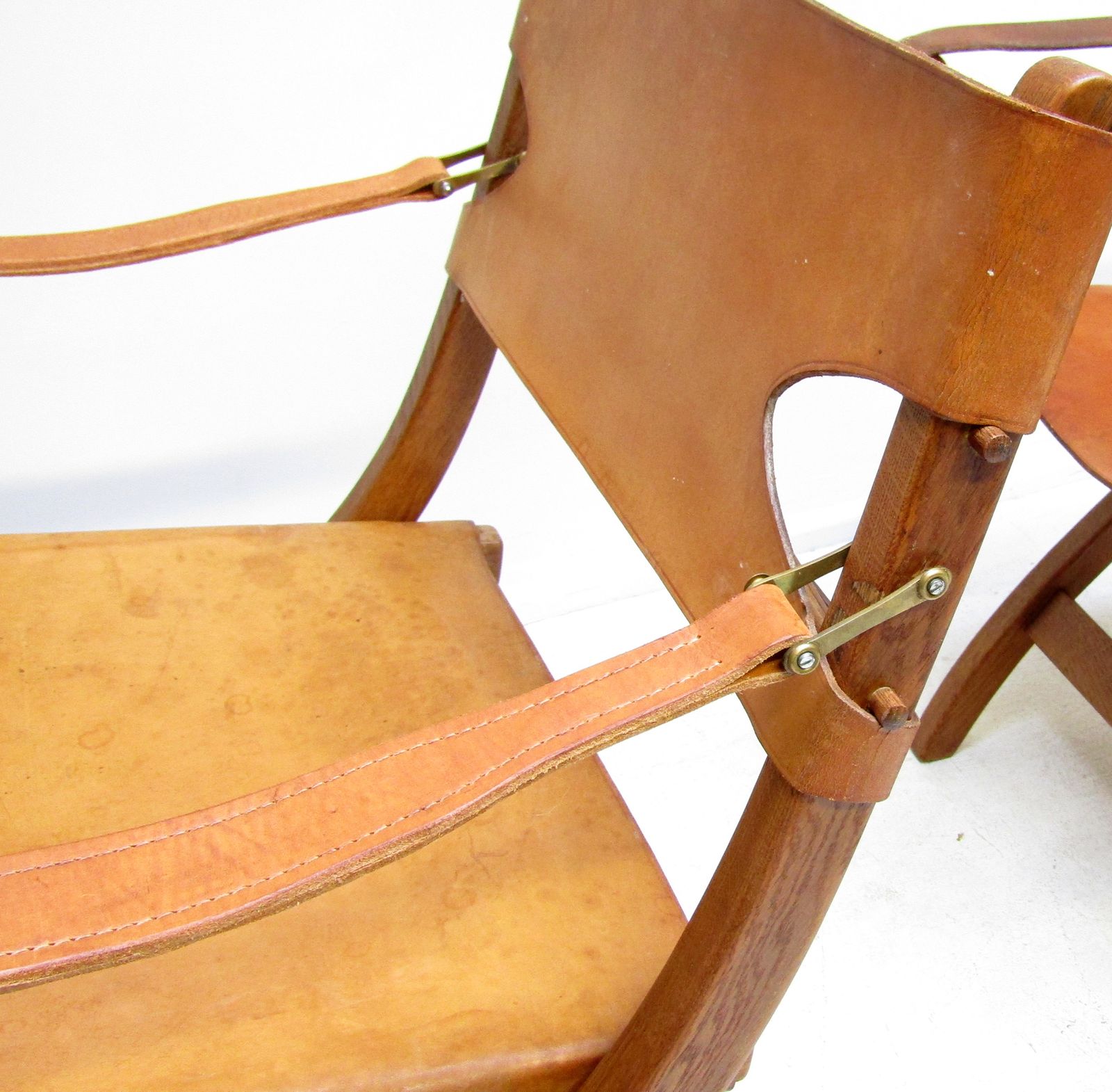 photo furniture Two 1950s Danish Safari Chairs In Oak & Hide Leather By Poul Hundevad