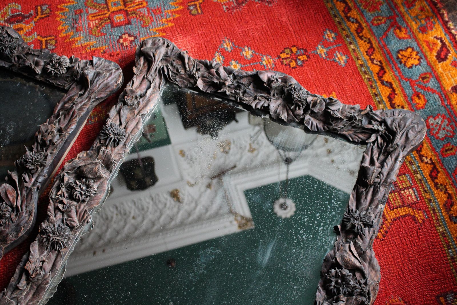 photo vinterior 19th Century Pair Of French Chateau Leather Appliqué Floral Mercury Wall Mirrors