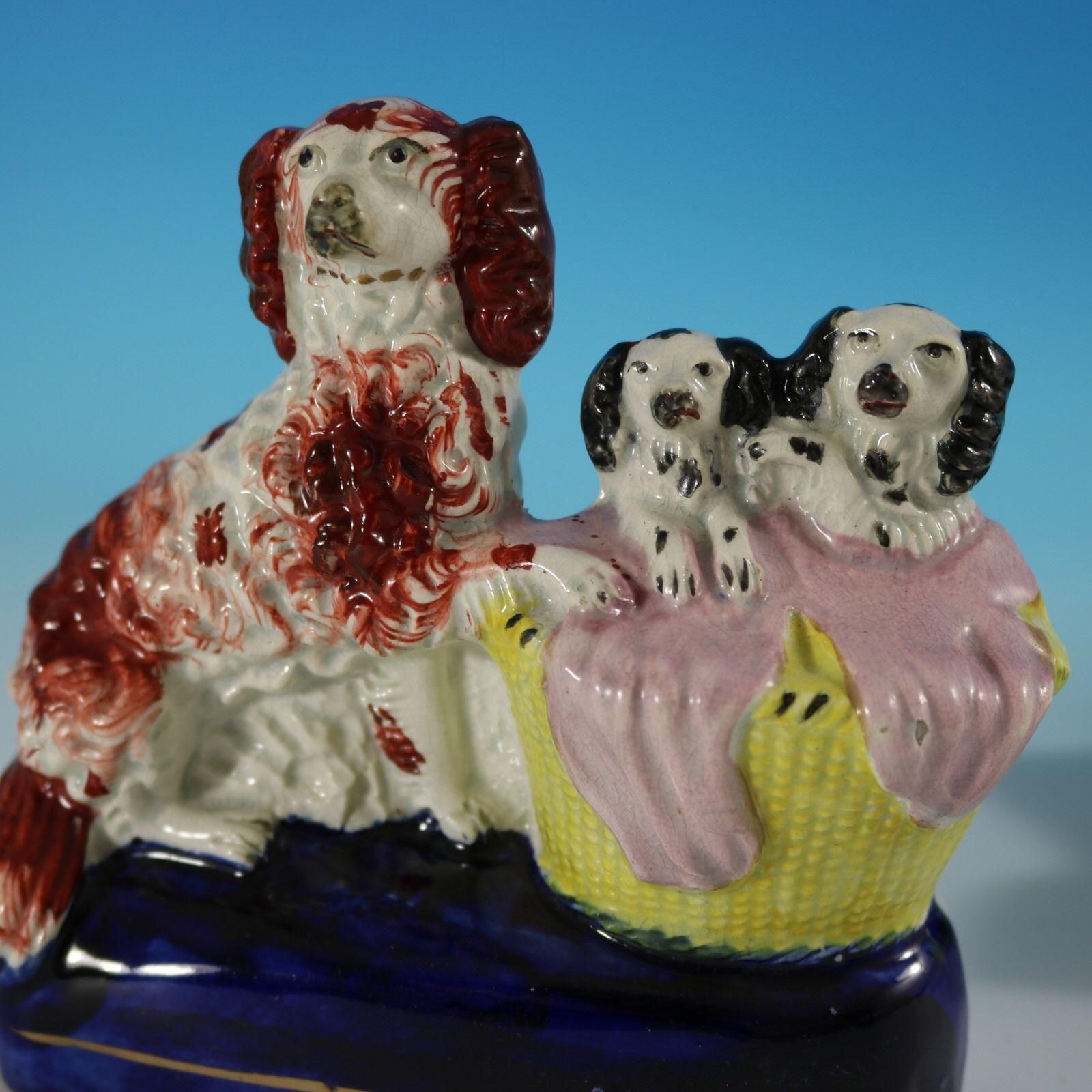 Art Pair Staffordshire Spaniel And Pups In Wash Baskets photo