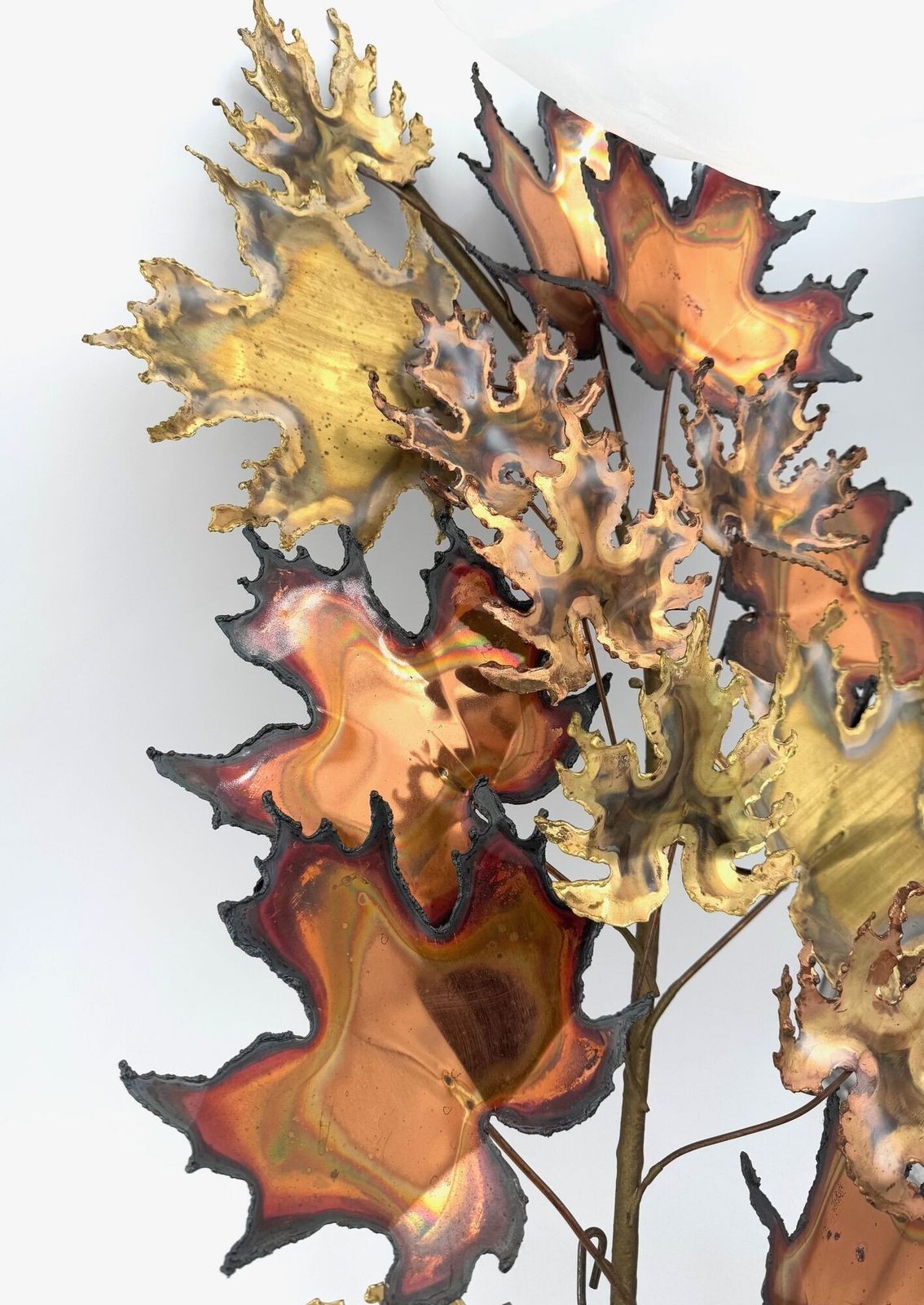 photo furniture A Pair Of Large 1970s Curtis Jere Torch Cut Brass And Bronze Maple Leaf Sculptures