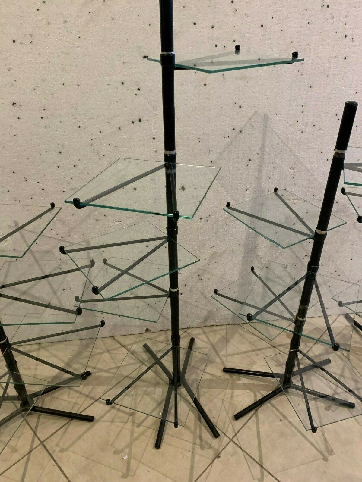 Suite Of Four Displays In Black Tube And 20th Century Glass Top photo for sale