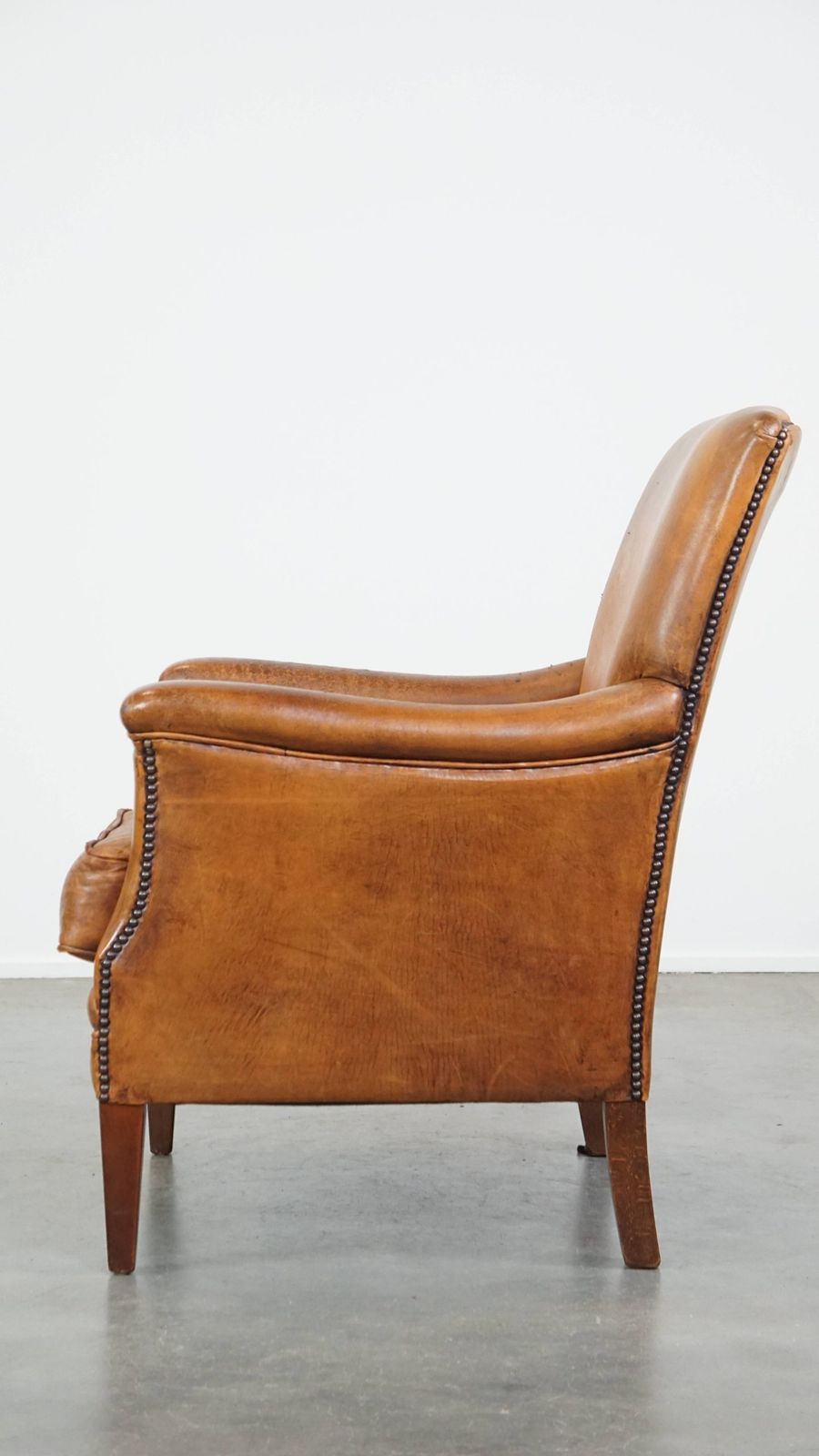 Characteristic And Comfortable Cognac Colored Sheepskin Armchair With Straight Shapes And A Beautiful Patina photo 789.7257