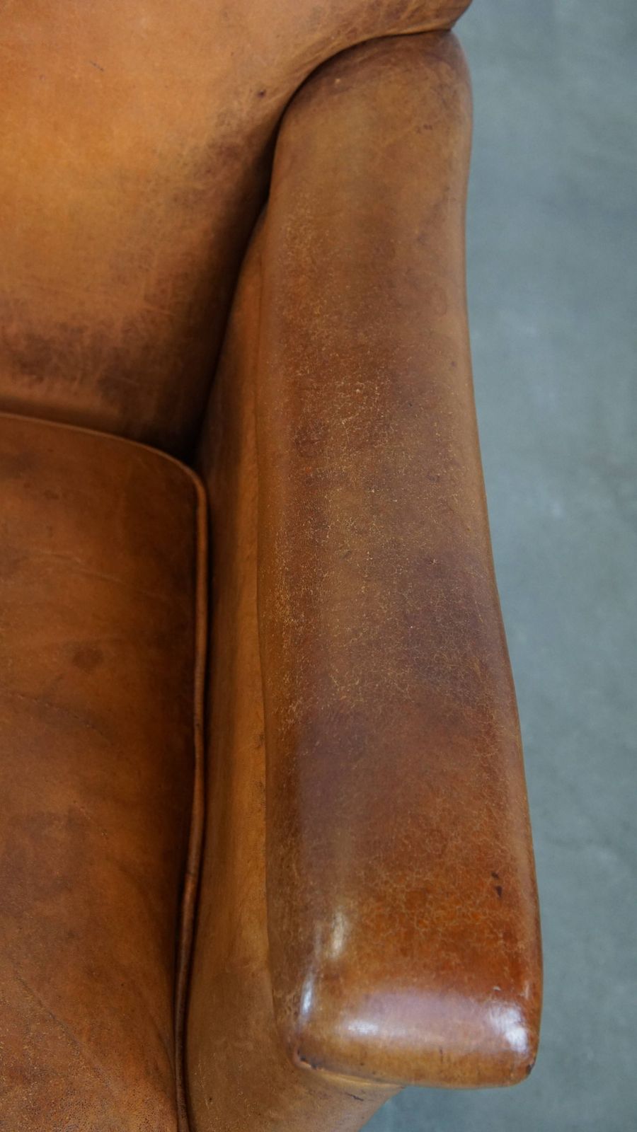 Characteristic And Comfortable Cognac Colored Sheepskin Armchair With Straight Shapes And A Beautiful Patina photo vintage