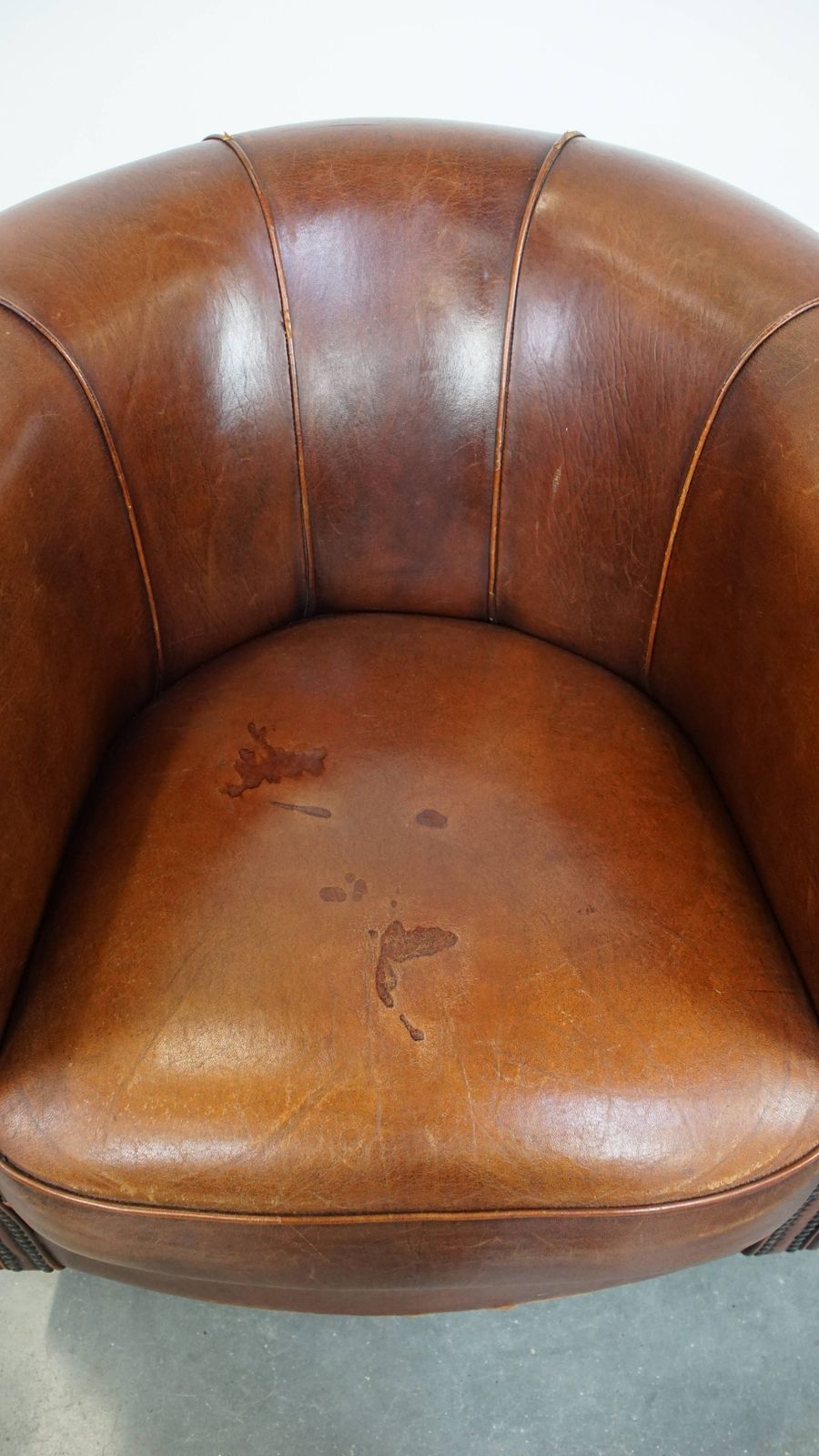 Sheepskin Club Chair In A Charming Cognac Colour And Finished With Piping On The Backrest photo vinterior