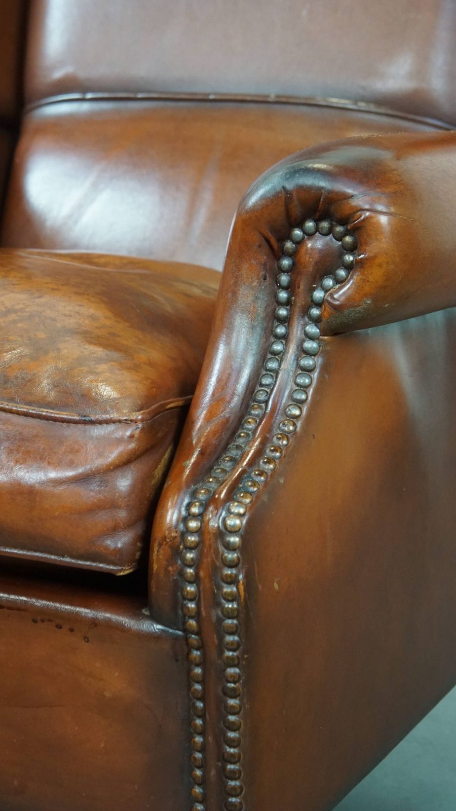 photo furniture Comfortable Sheepskin Wing Chair With A Warm Color Scheme And A Beautiful Patina