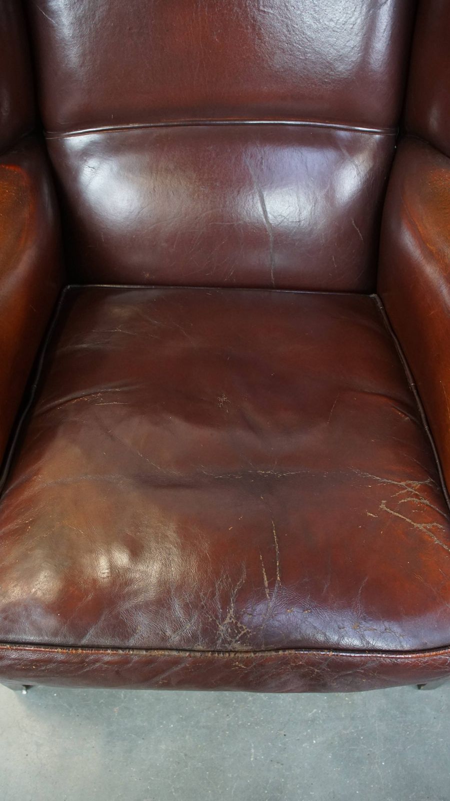 Classic, Luxurious And Comfortable Dark English Style Sheepskin Wing Chair With Lots Of Character And A Beautiful Patina photo vinterior